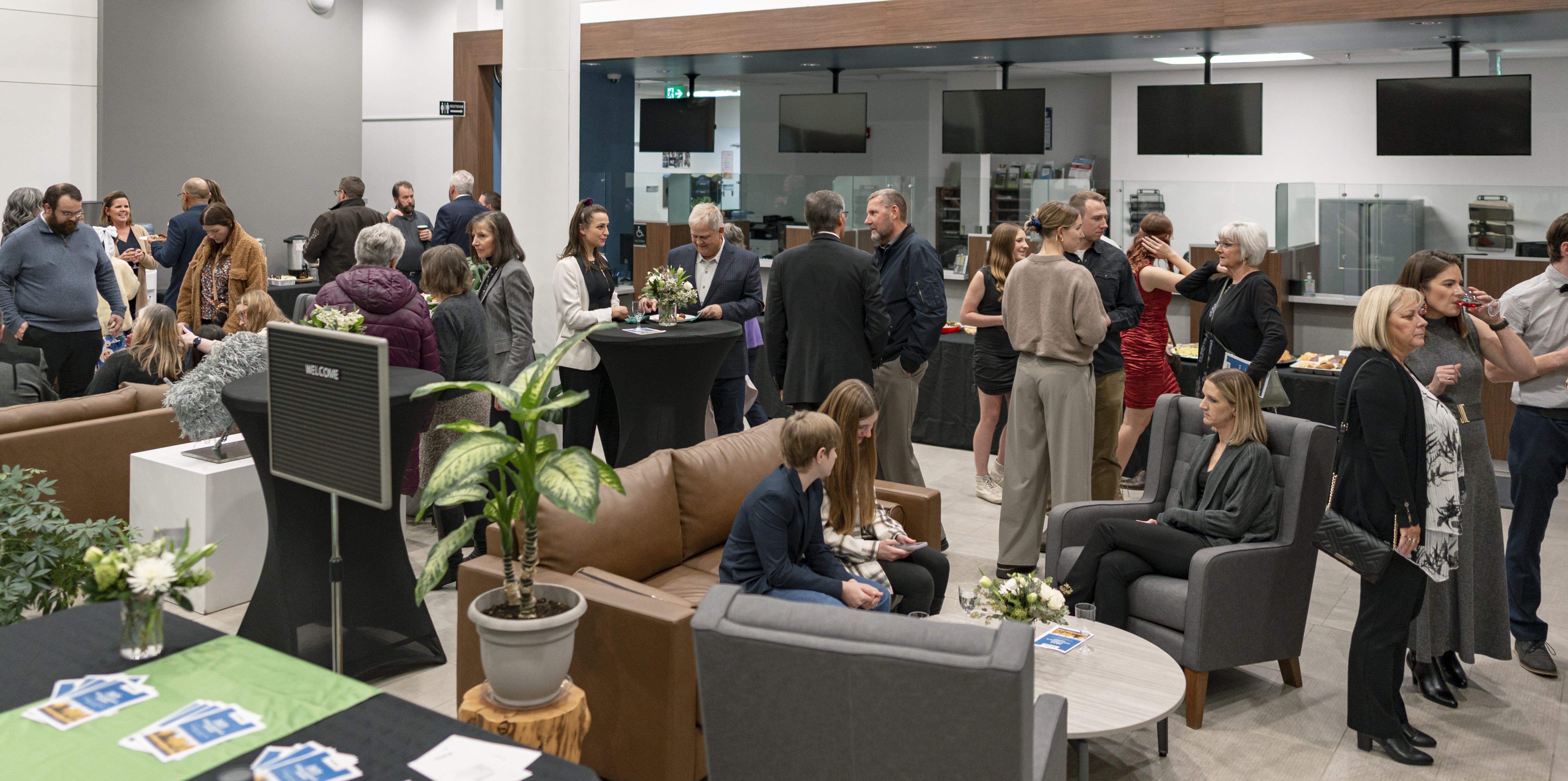 Image of a group of people networking in Parkland County Centre lobby